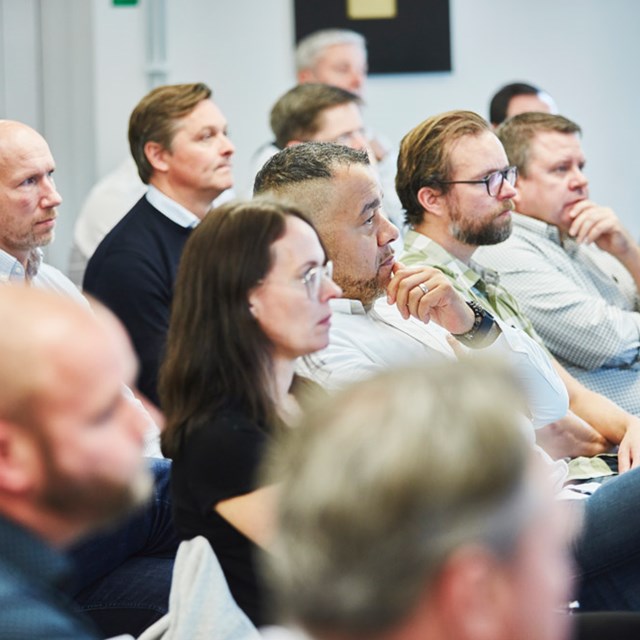 People listening to speaker